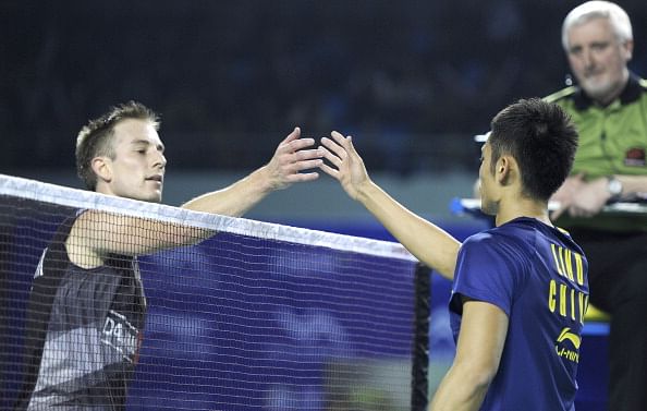 Lin Dan of China (R) shakes hands with P