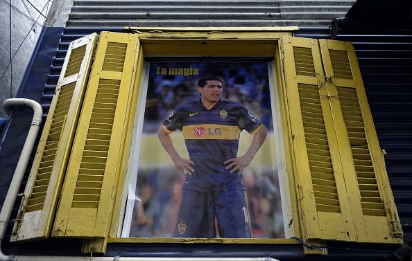 A poster of midfielder Juan Roman Riquel