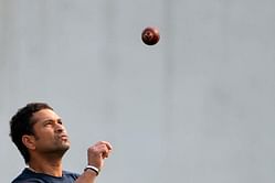 Tendulkar teaches youngster how to bowl