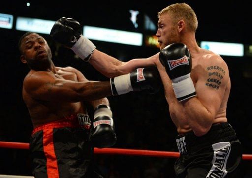 Flintoff comes off canvas to win debut fight