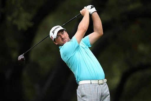 Graeme McDowell finished with seven birdies in a six-under 66 for a three-shot lead