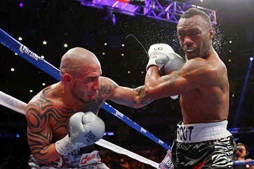Miguel Cotto (L), a three-division world champion, fell to 37-4 with 30 wins inside the distance