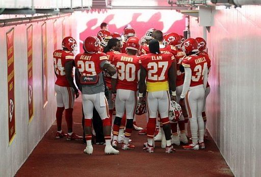 Kansas City Chiefs players huddle in prayer in the tunnel to the field prior to the game against the Carolina Panthers