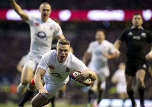 England wing Chris Ashton goes over the try line as New Zealand went down 38-21 at Twickenham