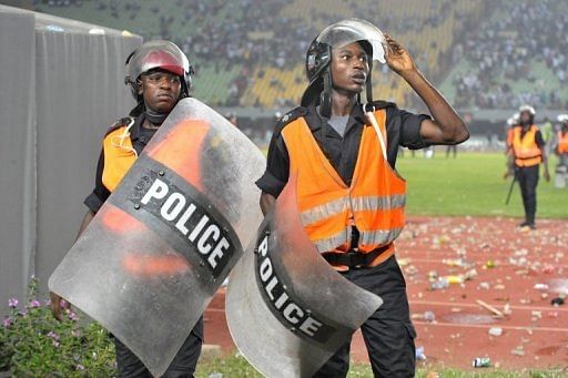 The match was initially suspended for about 40 minutes as stones, bottles and chairs rained down on Ivory Coast players