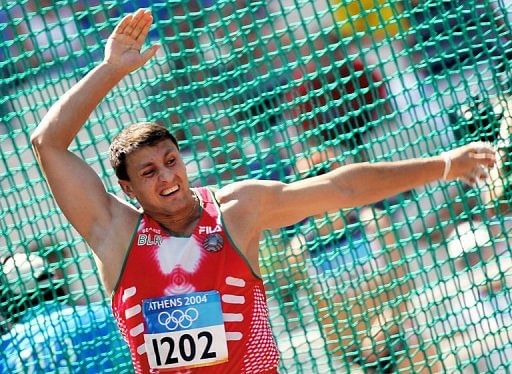 Ivan Tikhon of Belarus competes in the men&#039;s hammer throw qualification during the 2004 Olympic Games