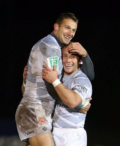 Castres players Romain Martial (L) and Marc Andreu celebrate following their victory