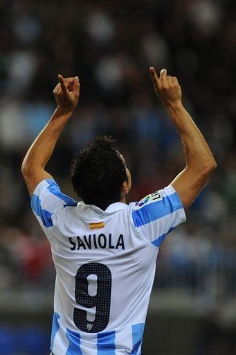 Malaga&#039;s forward Javier Saviola celebrates after scoring