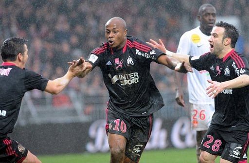 Marseille&#039;s Andre Ayew (C) is congratulated by teammates after scoring against Brest, on December 2