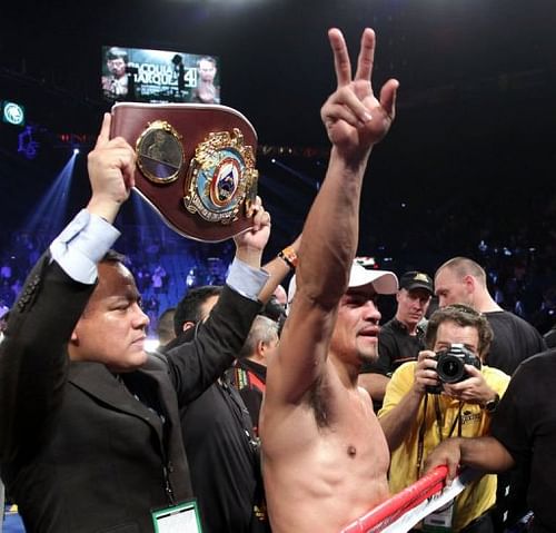 Juan Manuel Marquez waves to the crowd after knocking out Manny Pacquiao