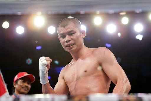 Indonesian boxer Chris John, pictured, hopes Juan Manuel Marquez will be tempted to settle another Asian score