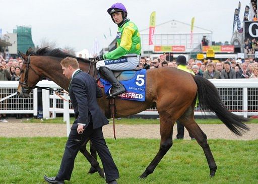 &#039;Kauto Star&#039; ridden by Ruby Walsh pulls up during the Cheltenham Gold Cup Chase on 16 March 2012
