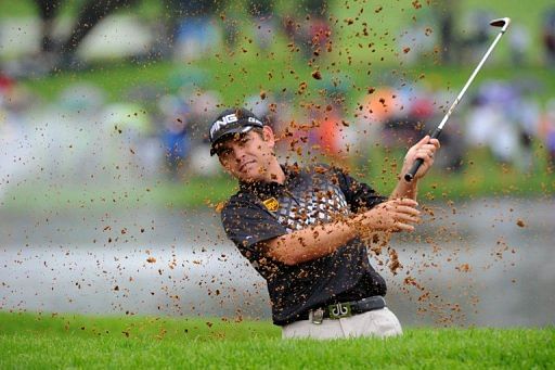 Louis Oosthuizen plays a shot out of a bunker on the 18th during the Nedbank Golf Challenge in Sun City on December 2