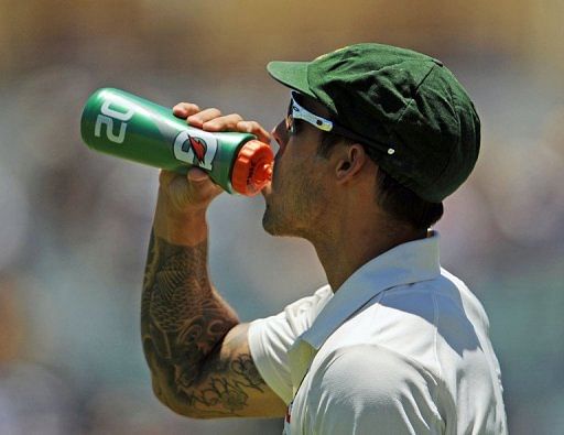 Mitchell Johnson takes a drink in the third Test against South Africa at the WACA ground in Perth on December 2, 2012