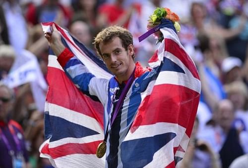 Andy Murray poses with his gold medal after winning the men's singles at the London Olympics on August 5, 2012.