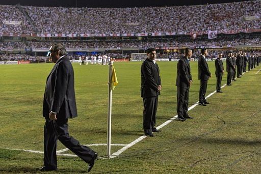Security guards on duty ahead of the Copa Sudamericana final at Morumbi stadium, Sao Paulo, Brazil, on December 12, 2012