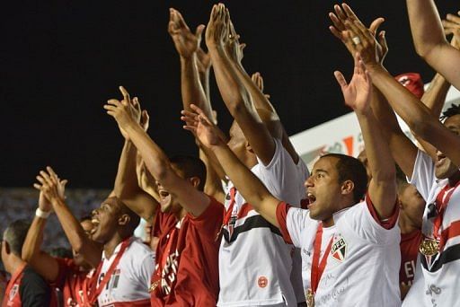 Sao Paulo players cheer as they are awarded victory in the Copa Sudamericana final in Sao Paulo on December 12, 2012
