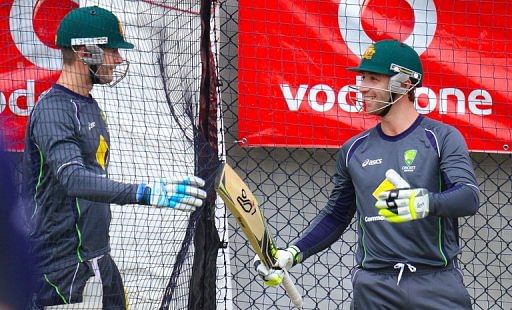 Michael Clarke (left) and team-mate Phil Hughes at a training session  in Hobart on December 13, 2012.