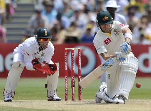 Michael Clarke (right) plays a shot against South Africa at the Adelaide Oval on November 25, 2012