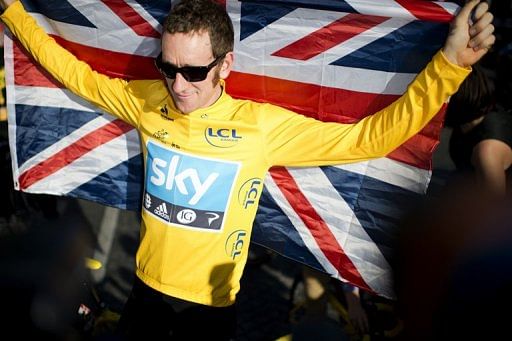 Bradley Wiggins celebrates at the Champs Elysees in Paris on July 22, 2012 after winning the Tour de France