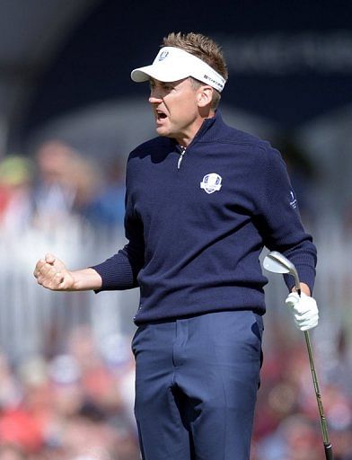 Ian Poulter celebrates a birdie on the final day of the Ryder Cup at Medinah on September 30, 2012