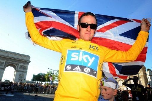Bradley Wiggins and his son at the Arc de Triomphe on July 22, 2012 after Wiggins won the Tour de France