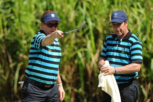 Miguel Angel Jimenez (left) and Jose Maria Olazabal play in the Royal Trophy in Brunei on December 14, 2012