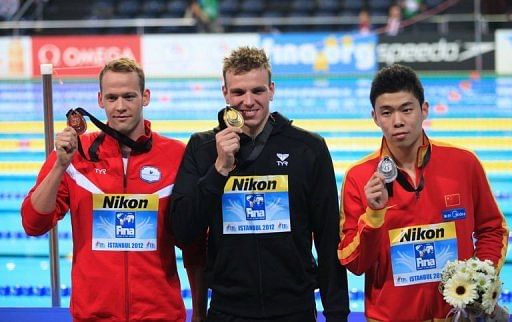 Paul Biedermann of Germany, Yun Hao of China (R) and Mads Glaesner (L) on December 14, 2012
