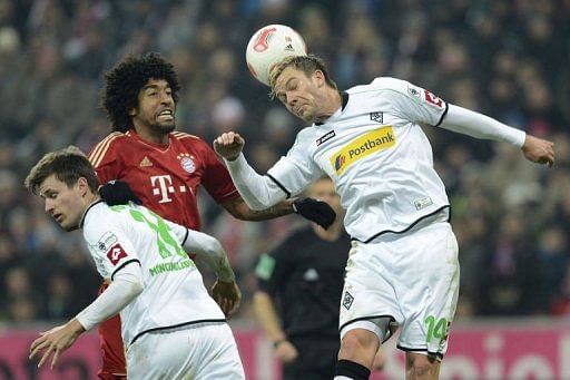 Runaway Bayern go 12 clear despite Gladbach draw