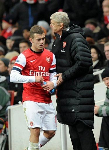 Arsenal&#039;s manager Arsene Wenger (R), seen here with midfielder Jack Wilshere, in London, on December 1, 2012