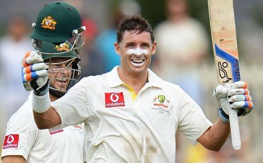 Australia&#039;s batsman Mike Hussey (right) celebrates his century against Sri Lanka, in Hobart, on December 15