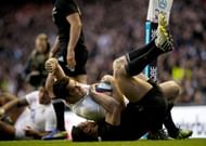 England's Brad Barritt (C) celebrates scoring a try against New Zealand, at Twickenham Stadium, on December 1, 2012