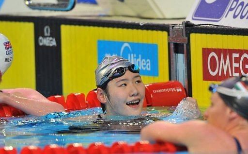 Ye Shiwen (C) of China celebrates her gold medal in the womens 200m individual medley final on December 15, 2012
