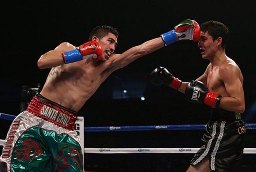 Leo Santa Cruz (L) throws a left hand at Alberto Guevara in Los Angeles on December 15, 2012