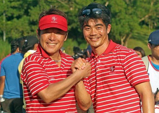 Asia Team Captain Naomichi Joe Ozaki of Japan (left) and Vice Captain Lian Wen Chong celebrate