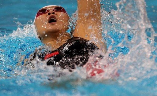 Zhao Jing competes in the women&#039;s 100m backstroke final during the Asian Swimming Championships on November 16, 2012