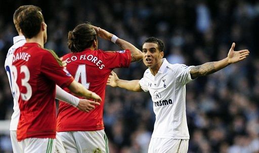 Tottenham defender Kyle Naughton (R) argues with Swansea defender Chico Flores at White Hart Lane on December 16, 2012