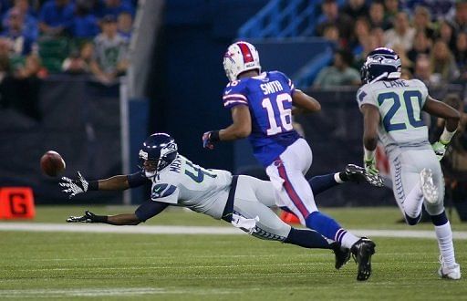 Byron Maxwell of the Seattle Seahawks fails to reach a pass for an interception on December 16, 2012 in Toronto, Canada