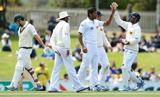 Chanaka Welegedara (3rd R) celebrates after dismissing Ed Cowan (L) at the first Hobart Test on December 17, 2012