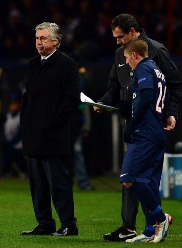 Paris Saint-Germain&#039;s coach Carlo Ancelotti (left) on December 4, 2012 at the Parc des Princes stadium in Paris