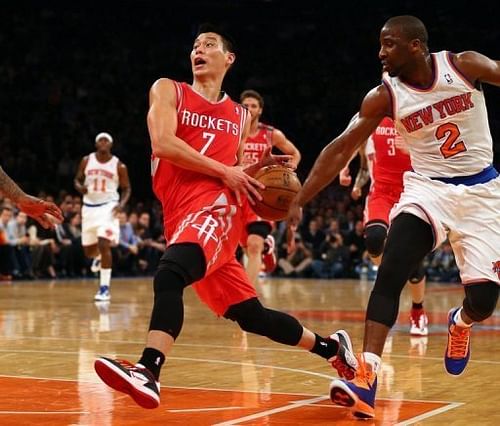 Jeremy Lin of the Houston Rockets heads for the net as Raymond Felton of the New York Knicks defends on December 17, 2012