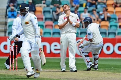 Australian bowler Shane Watson (C) looks to the heavens on the final day of the first Test in Hobart on December 18, 2012