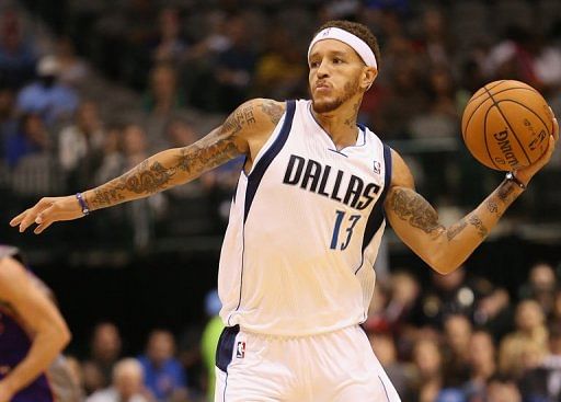 Delonte West of the Dallas Mavericks passes the ball against the Phoenix Suns during a preseason game on October 17, 2012