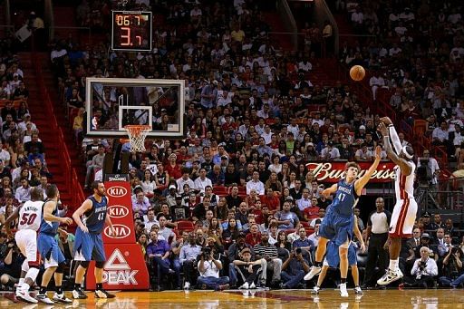 LeBron James of the Miami Heat shoots over Andrei Kirilenko of the Minnesota Timberwolves on December 18, 2012