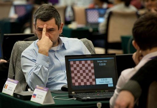 A chess player prepares to compete in a &#039;blinfold&#039; chess tournament in Beijing on December 19, 2012