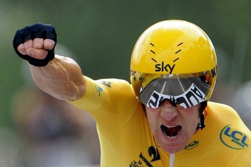 Bradley Wiggins celebrates at the end of the 19th stage of the Tour de France cycling race on July 21, 2012