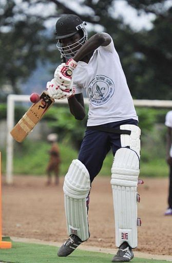 A man plays cricket at Kingtom Oval in Freetown, Sierra Leone&#039;s only cricket ground, on November 15, 2012