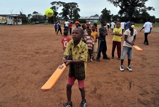 Boys learn to play cricket at Kingtom Oval in Freetown, Sierra Leone&#039;s only cricket ground, on November 15, 2012