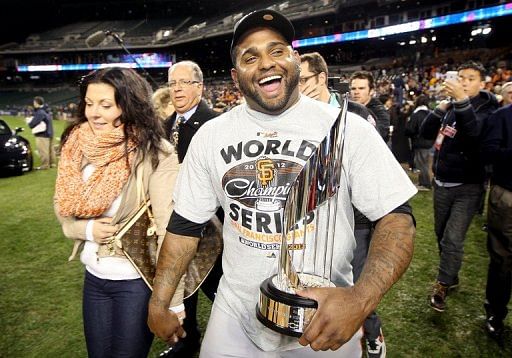 Pablo Sandoval of the San Francisco Giants celebrates with the Most Valuable Player trophy on October 28, 2012