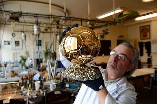 Artisan Michel Garault works on the Ballon d&#039;Or 2012 at the Mellerio jewelery workshops in Paris on December 6, 2012